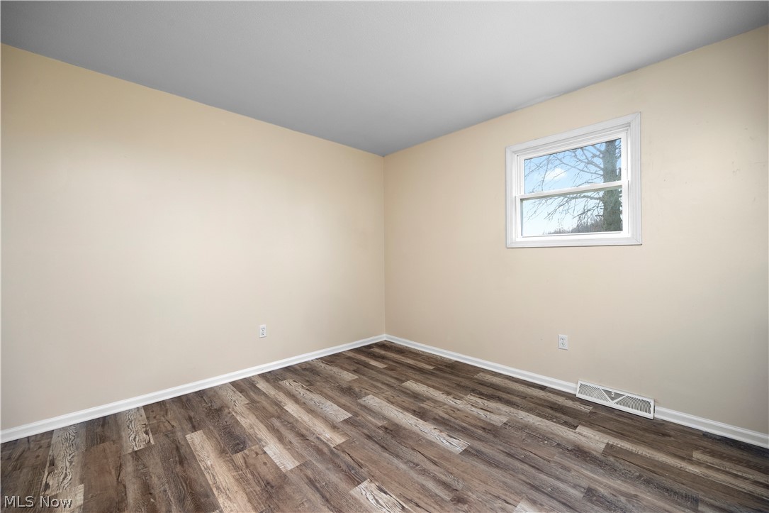 34725 Capel Road Columbia Station, OH 44028 - Photo 17 of 47 Room featuring wood-finish flooring, light neutral wall paint, and white baseboards