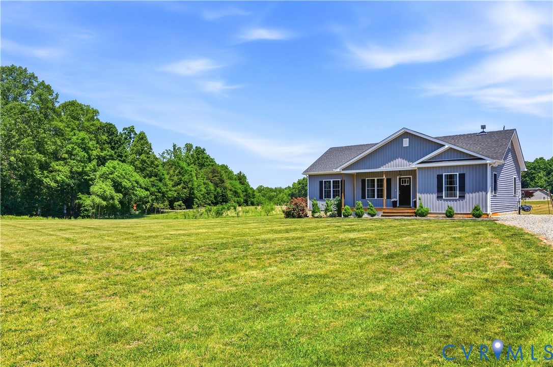 235 Stoney Point Road Cumberland, VA 23040 - Photo 4 of 35 a front view of a house with yard and green space