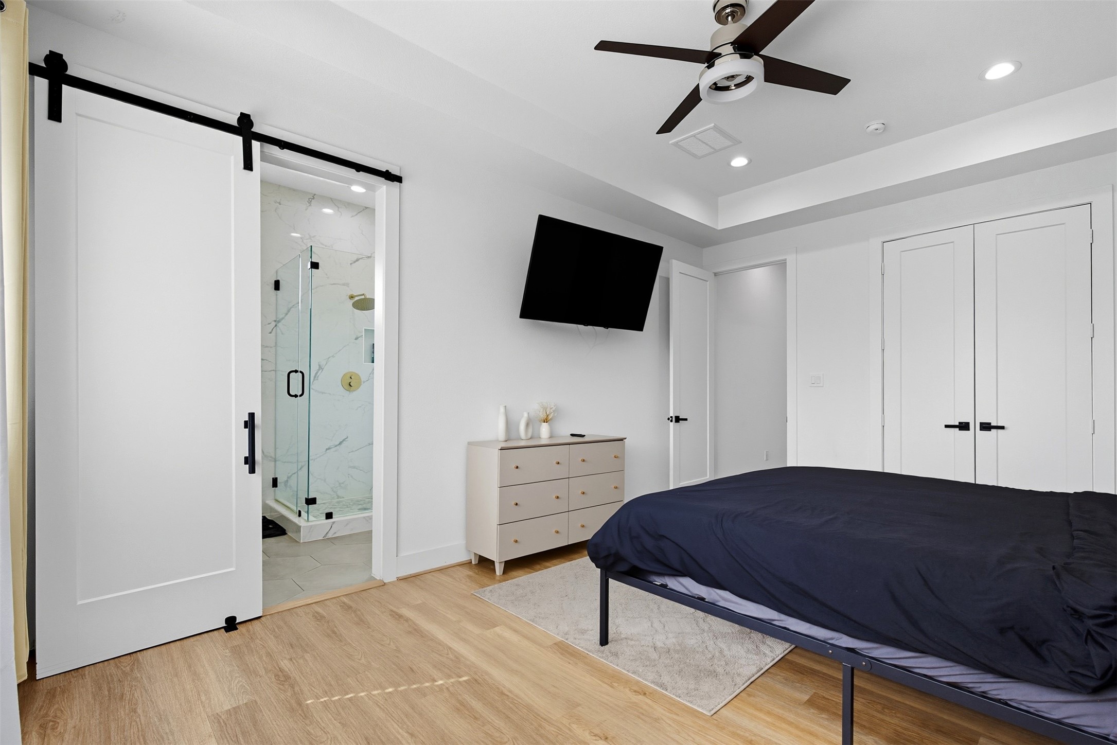 3605 Bremond Street Houston, TX 77004 - Photo 12 of 35 a bedroom with a bed and a flat screen tv