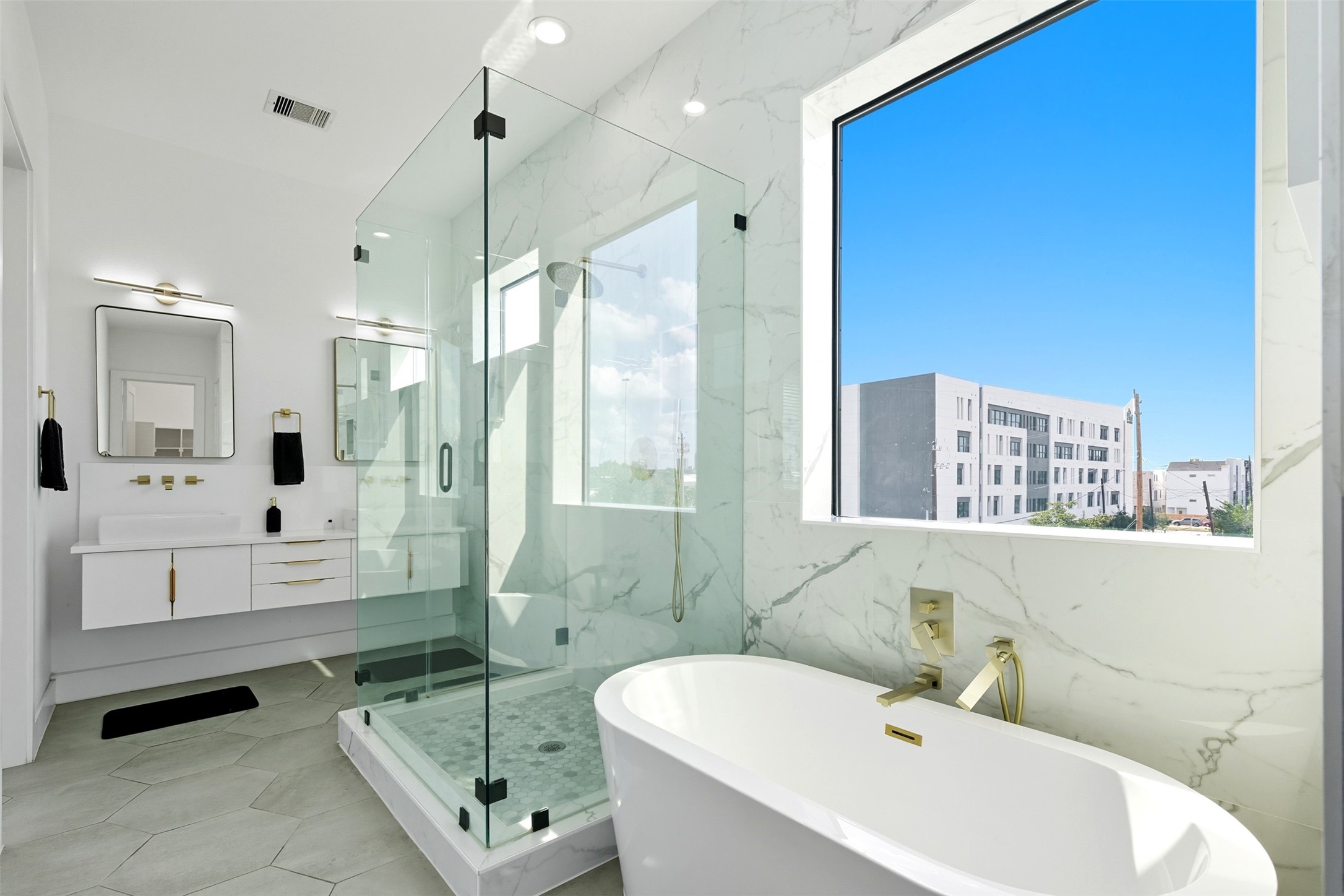 3605 Bremond Street Houston, TX 77004 - Photo 13 of 35 a bathroom with a bathtub shower sink mirror and toilet