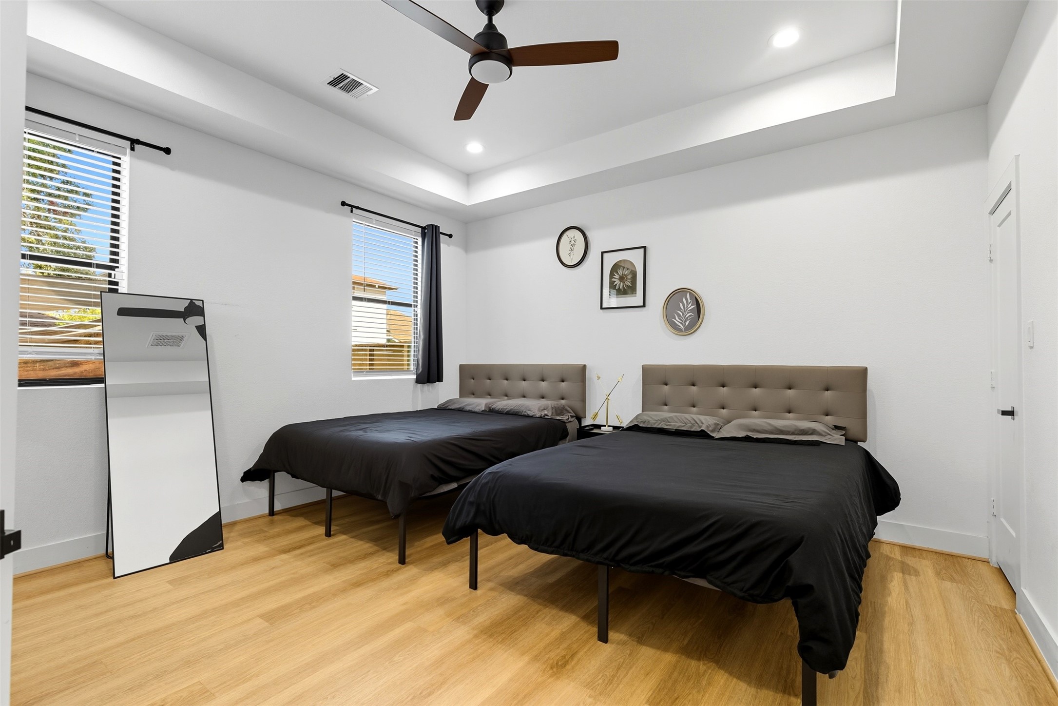 3605 Bremond Street Houston, TX 77004 - Photo 19 of 35 a bedroom with two beds and a dresser