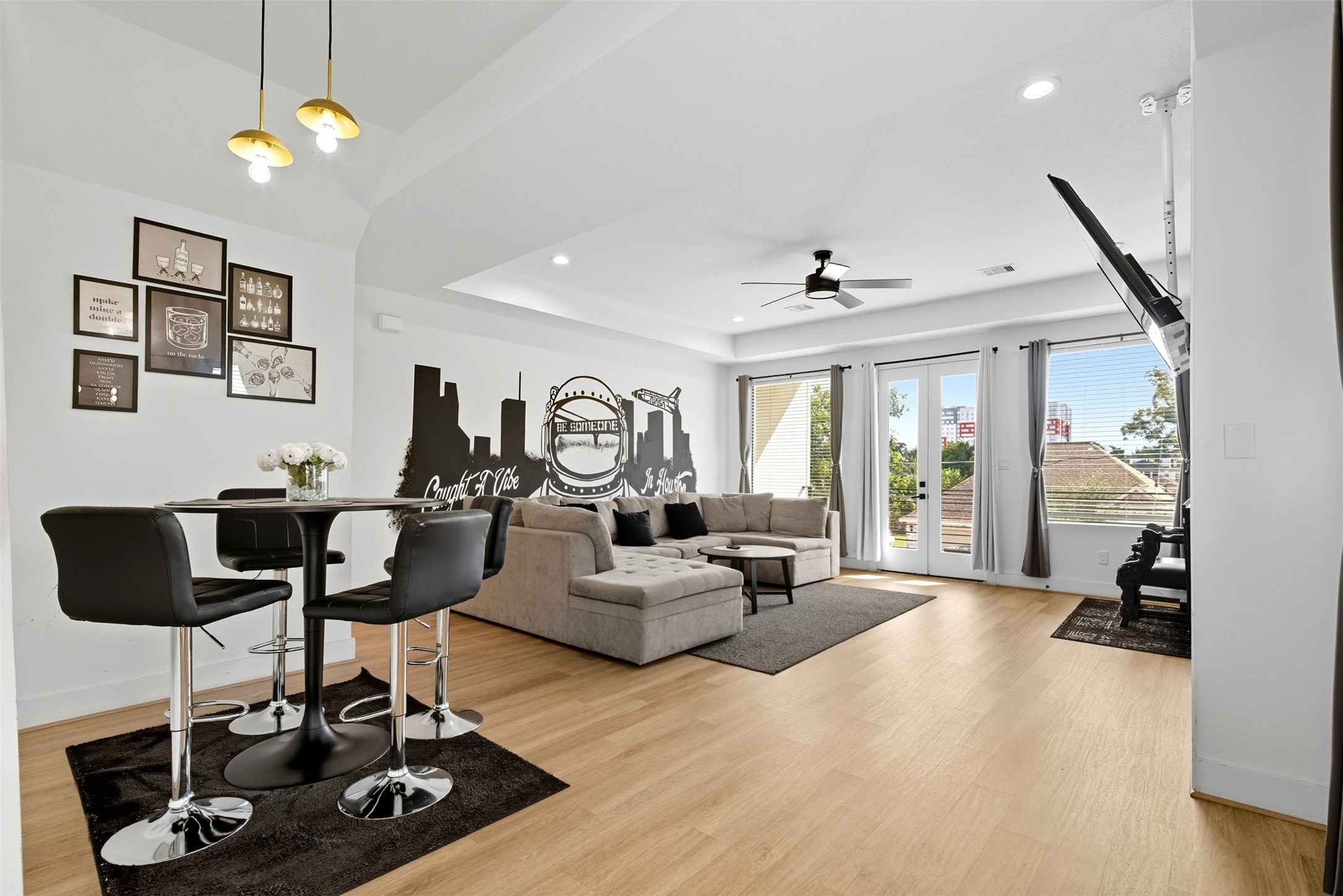 3605 Bremond Street Houston, TX 77004 - Photo 5 of 35 a living room with furniture a dining table and a floor to ceiling window