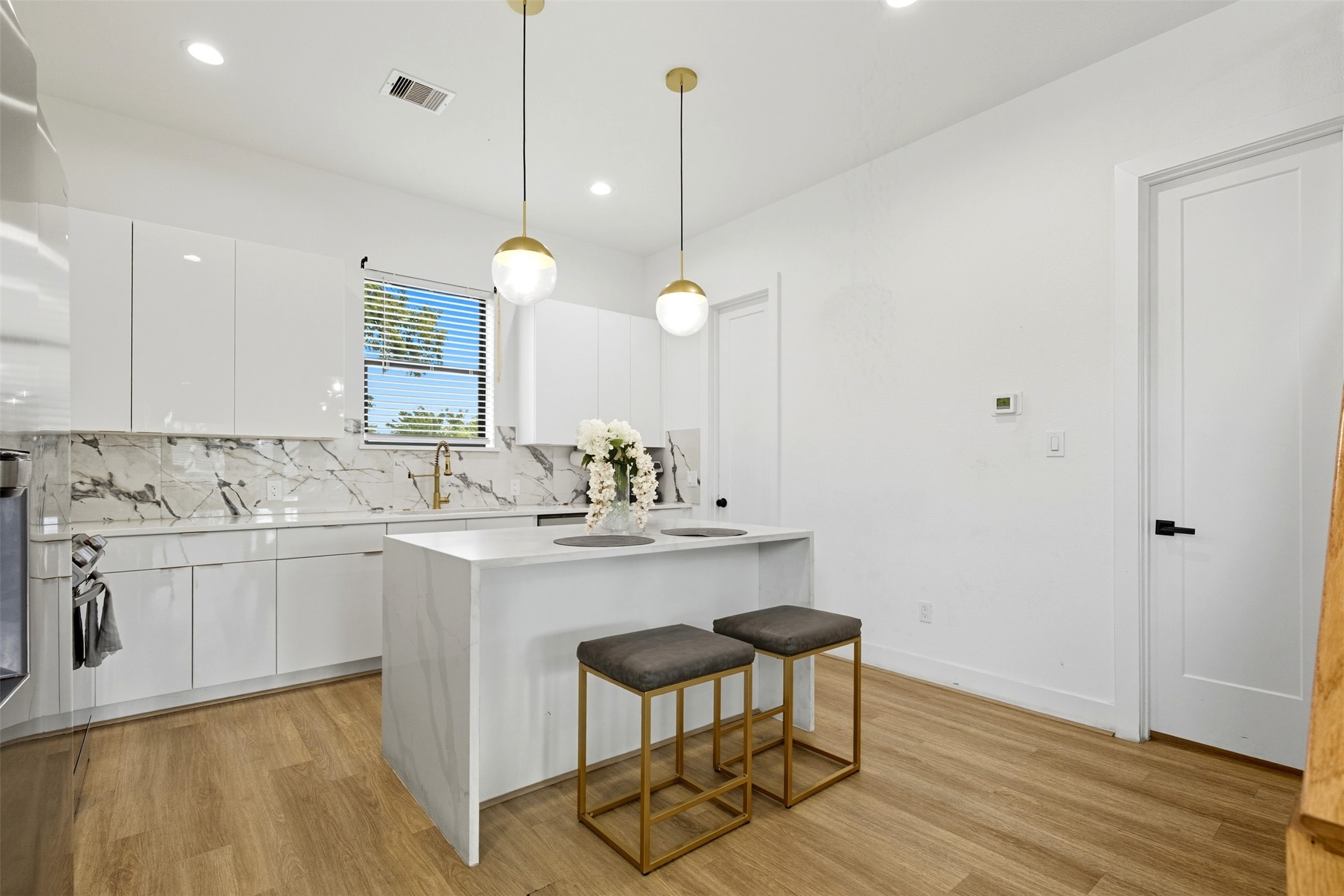 3605 Bremond Street Houston, TX 77004 - Photo 8 of 35 a kitchen with sink cabinets and wooden floor