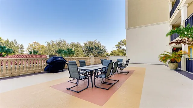 a view of a dining table and chairs in the patio