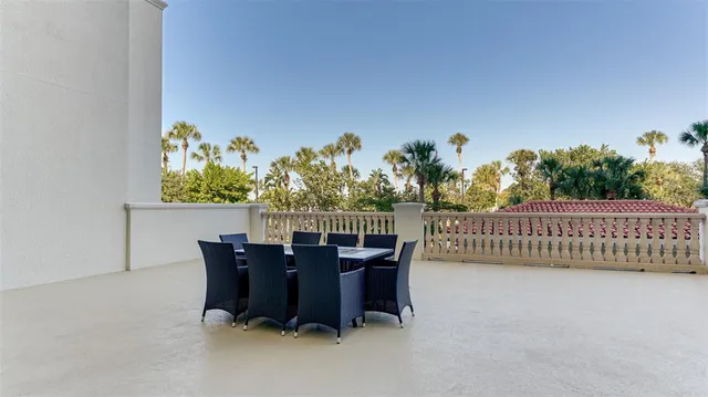 a view of a chairs and table in patio