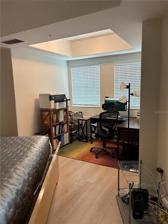 a bedroom with furniture and a window