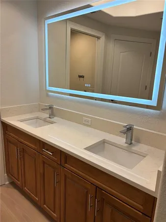 a bathroom with a sink and a mirror