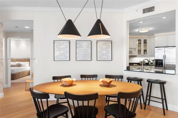 a dining room with furniture and window