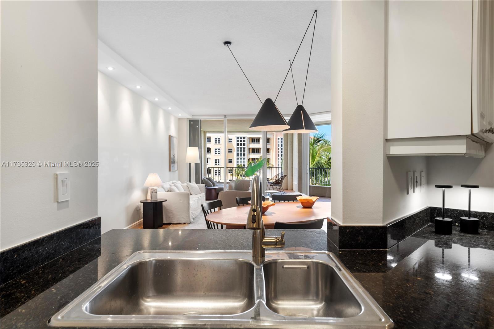 705 Crandon Boulevard, Unit 405 Key Biscayne, FL 33149 - Photo 13 of 29 a kitchen with a sink and a window