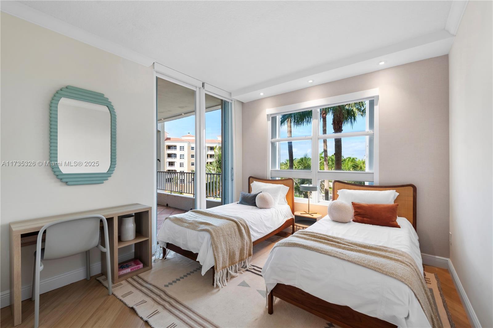 705 Crandon Boulevard, Unit 405 Key Biscayne, FL 33149 - Photo 23 of 29 a bedroom with two beds and a large window