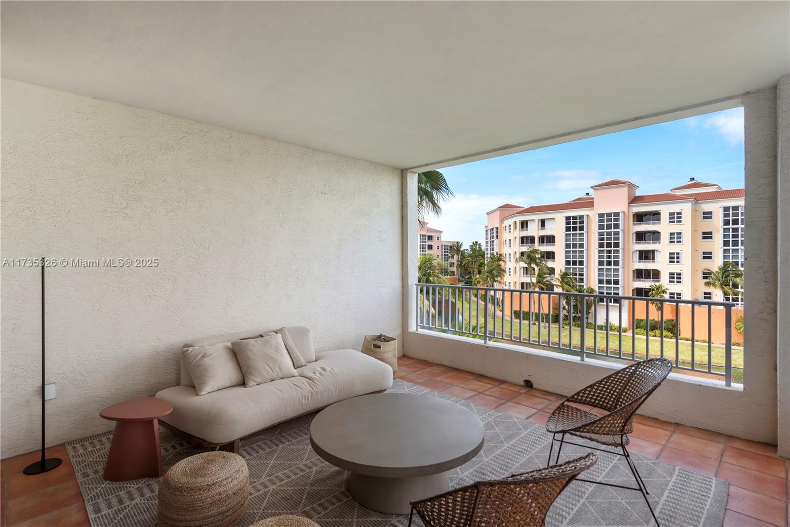 705 Crandon Boulevard, Unit 405 Key Biscayne, FL 33149 - Photo 3 of 29 a living room with furniture and a floor to ceiling window