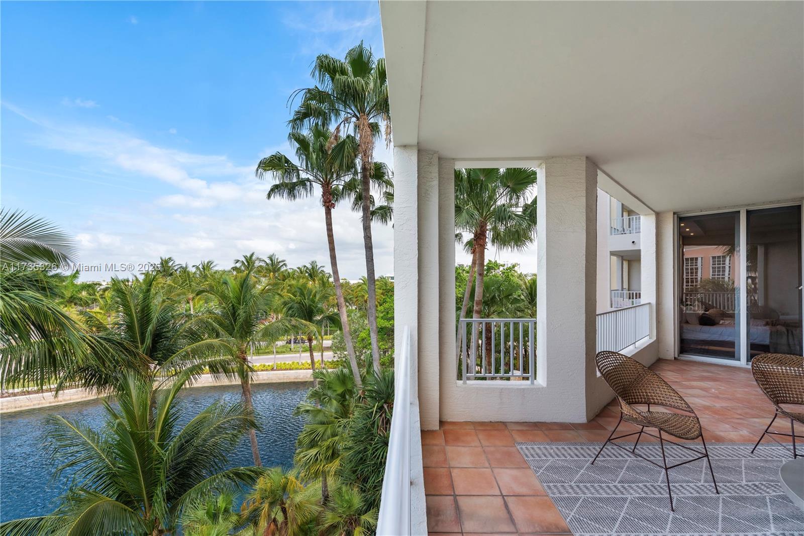 705 Crandon Boulevard, Unit 405 Key Biscayne, FL 33149 - Photo 5 of 29 a view of a porch with chairs and potted plants with sky view