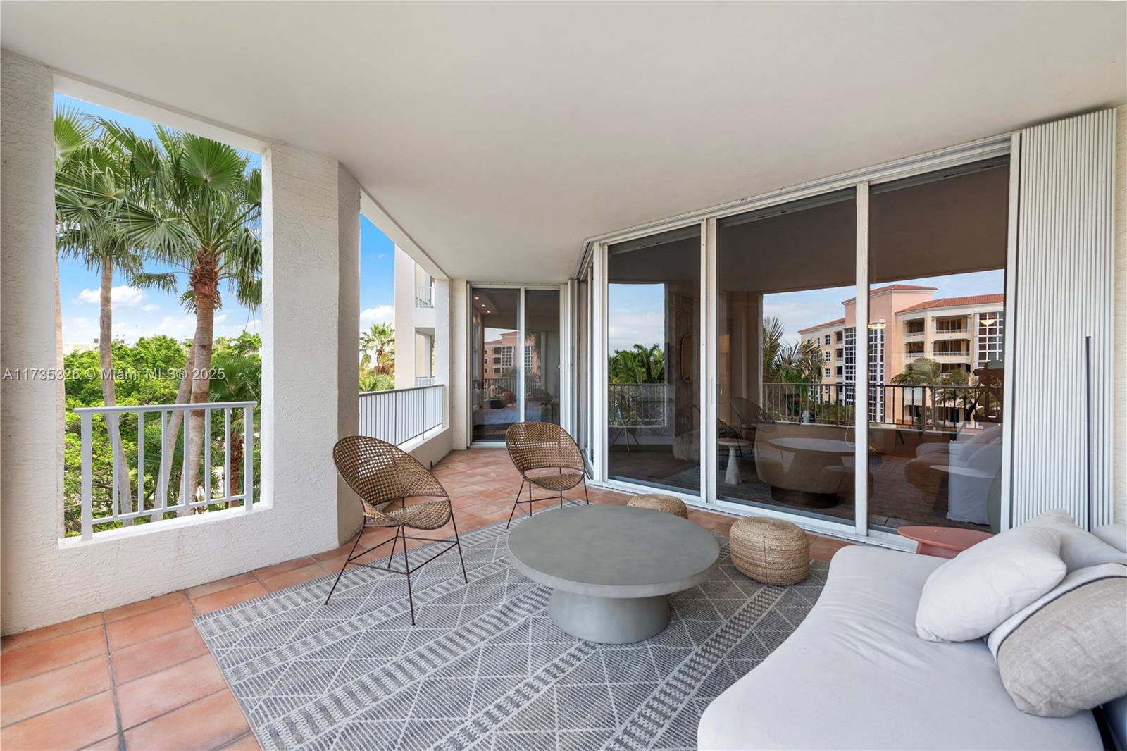 705 Crandon Boulevard, Unit 405 Key Biscayne, FL 33149 - Photo 6 of 29 a living room with furniture and a large window