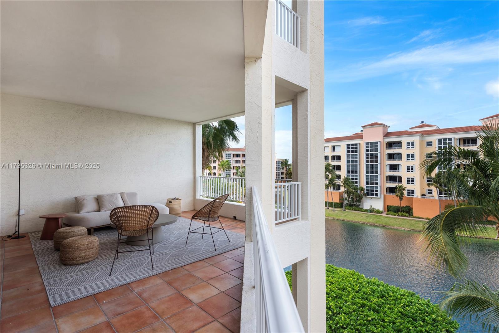 705 Crandon Boulevard, Unit 405 Key Biscayne, FL 33149 - Photo 7 of 29 a living room with furniture and a floor to ceiling window