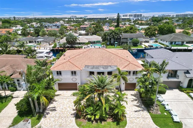 an aerial view of a house with a lake view