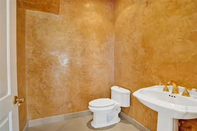 a view of an empty room with glass door and balcony