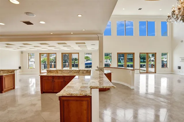 a bathroom with a granite countertop toilet a sink and a bathtub