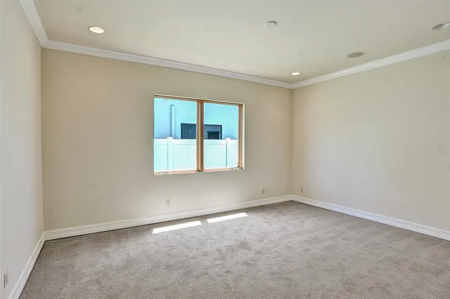 a view of a hallway with wooden stairs