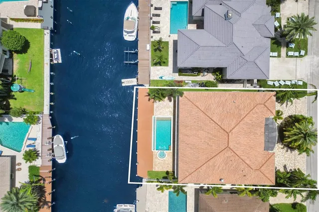 a kitchen with stainless steel appliances granite countertop a sink refrigerator and cabinets