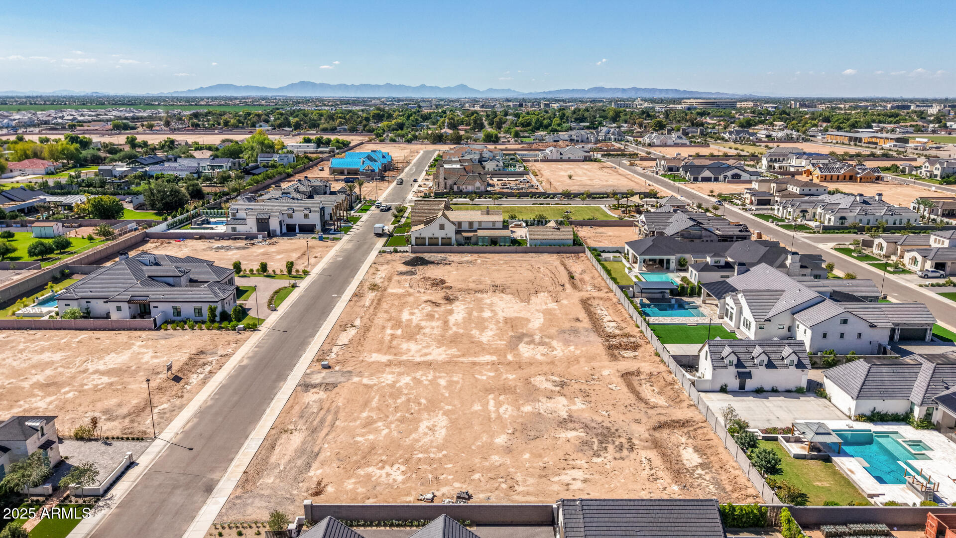 2694 East Blue Sage Road, Unit 127 Gilbert, AZ 85297 - Photo 1 of 12 an aerial view of a city