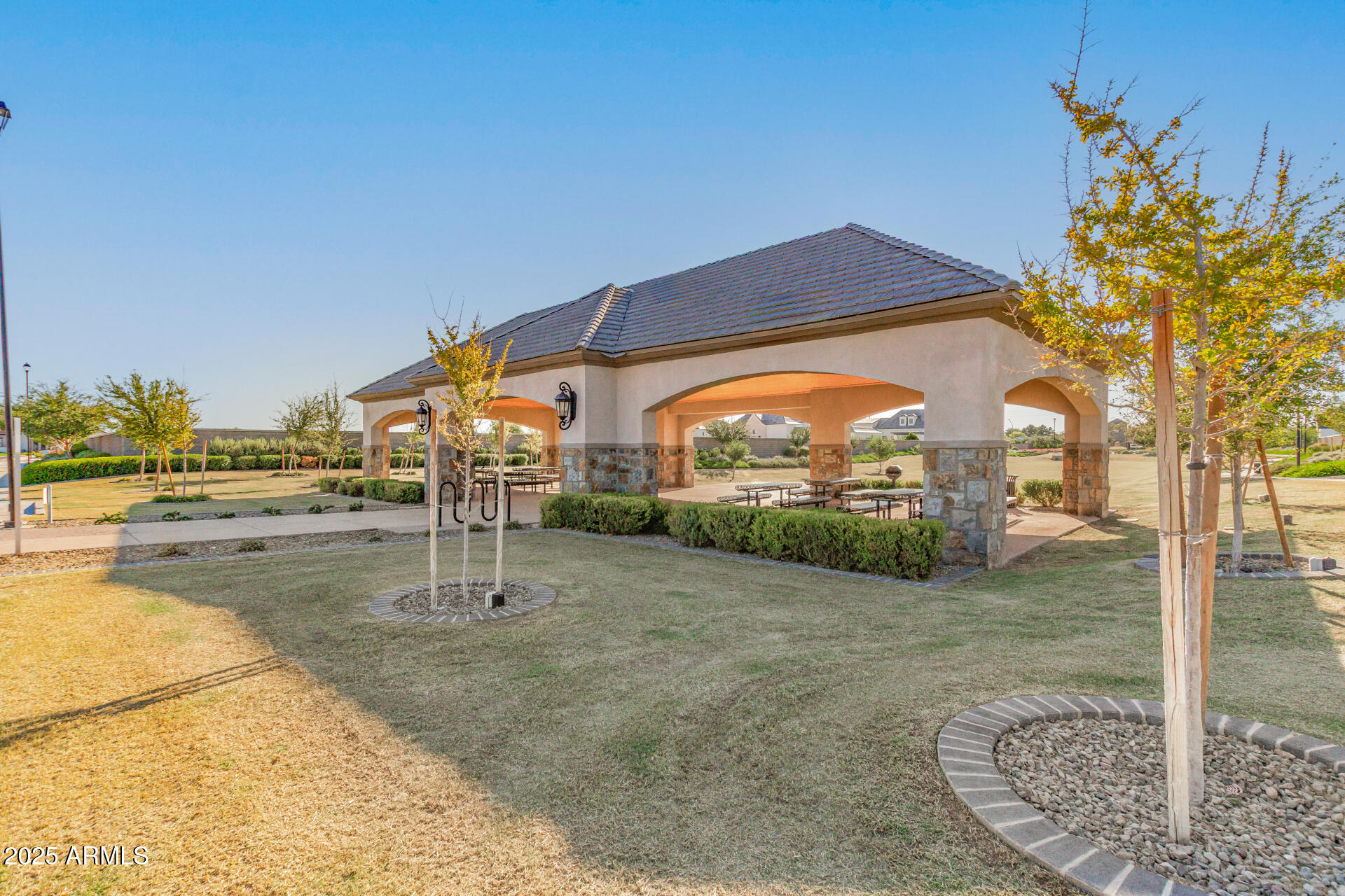 2694 East Blue Sage Road, Unit 127 Gilbert, AZ 85297 - Photo 2 of 12 a view of a garden