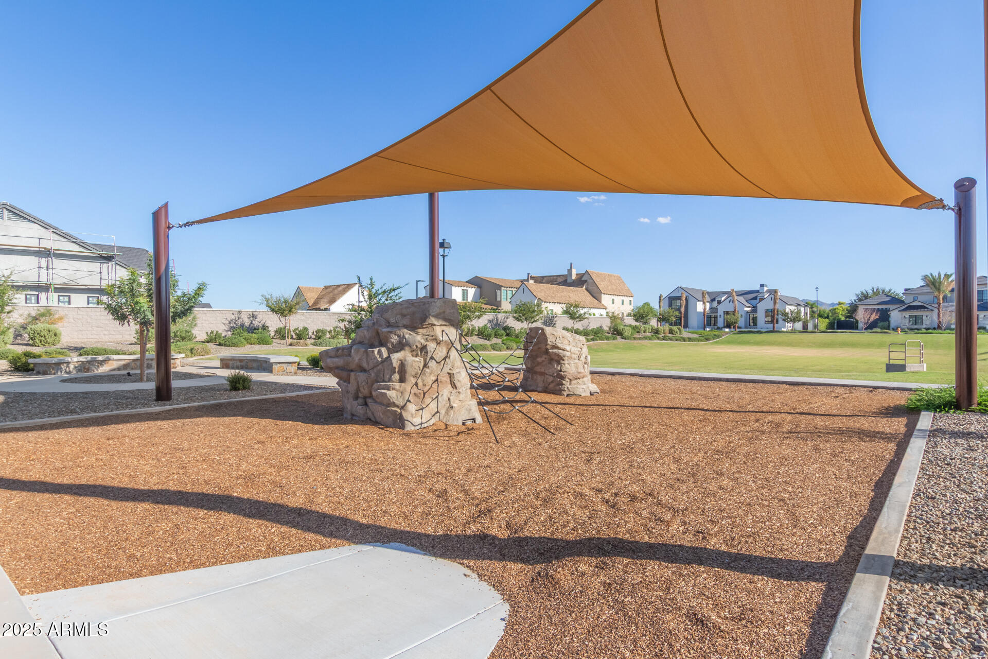 2694 East Blue Sage Road, Unit 127 Gilbert, AZ 85297 - Photo 6 of 12 a view of a balcony with chair and umbrella