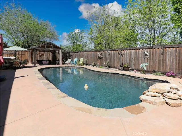 a view of a swimming pool with a patio