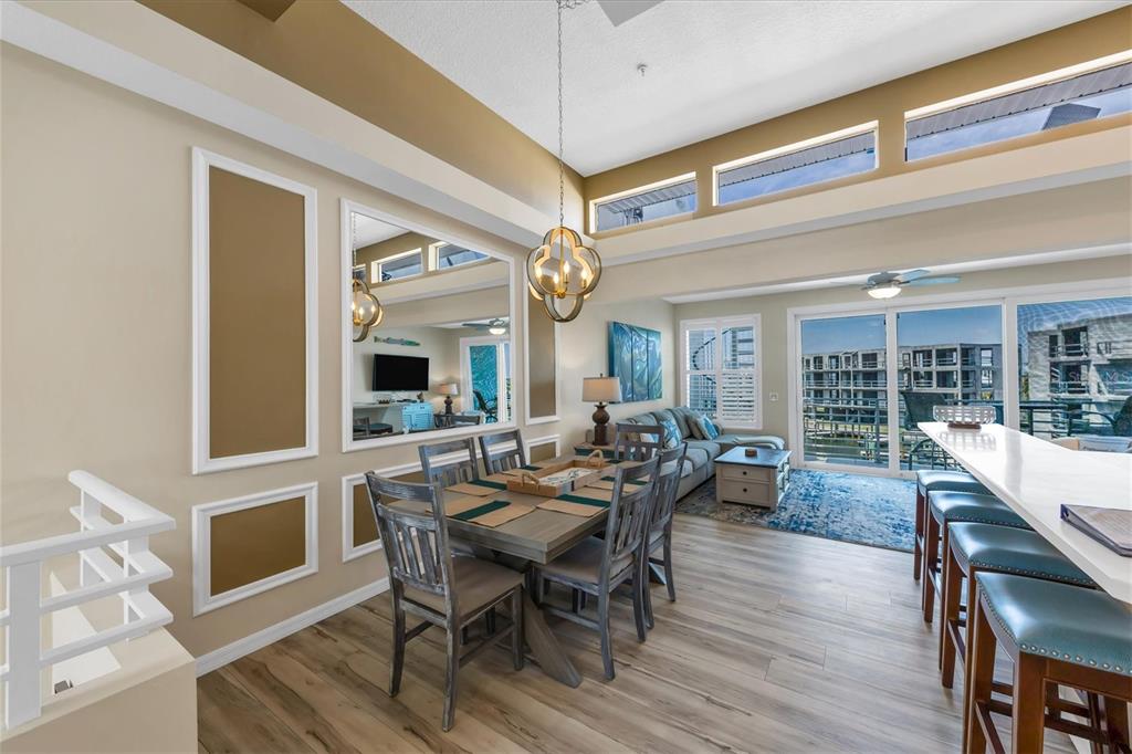 8272 Harborside Circle Englewood, FL 34224 - Photo 19 of 50 a view of a dining room with furniture window and wooden floor