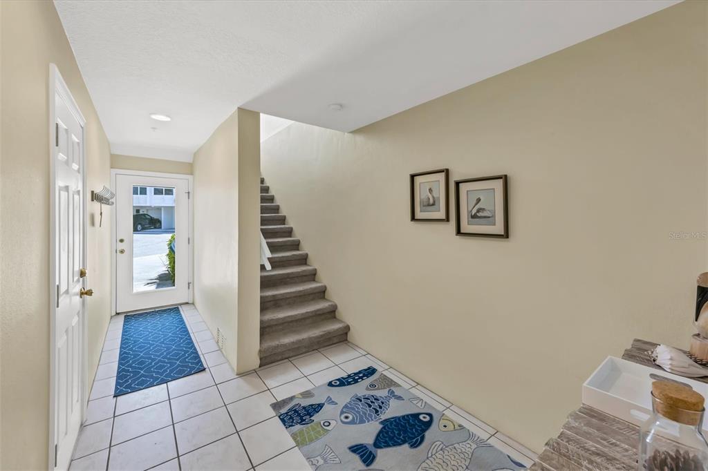 8272 Harborside Circle Englewood, FL 34224 - Photo 2 of 45 a view of a hallway with entryway wooden floor and front door