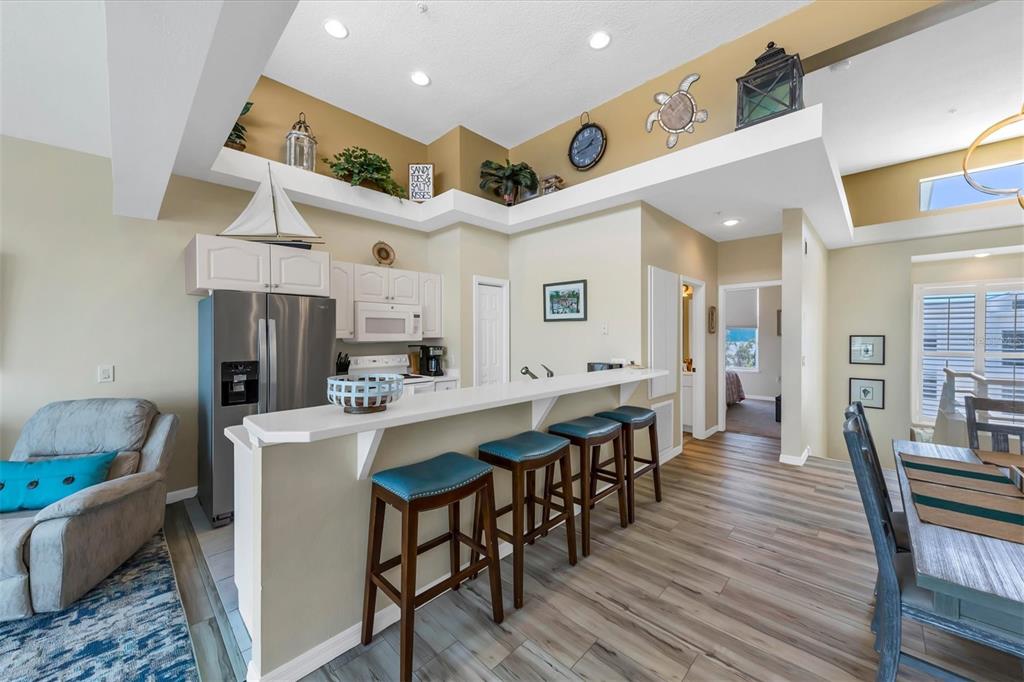 8272 Harborside Circle Englewood, FL 34224 - Photo 22 of 50 a large kitchen with a table and chairs