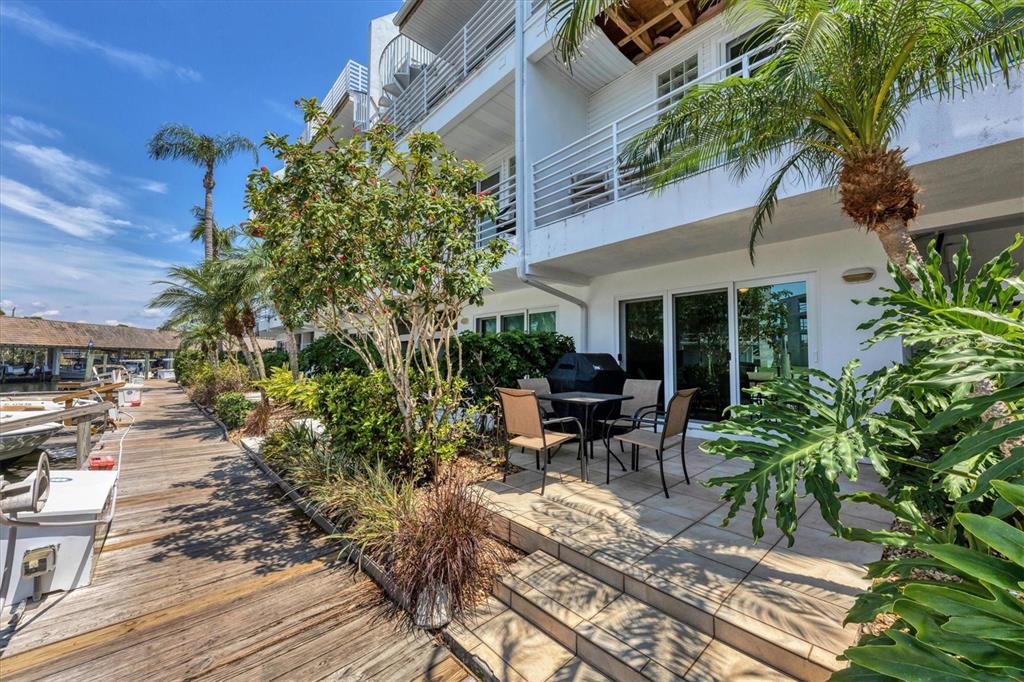 8272 Harborside Circle Englewood, FL 34224 - Photo 23 of 45 a view of backyard with outdoor seating and plants