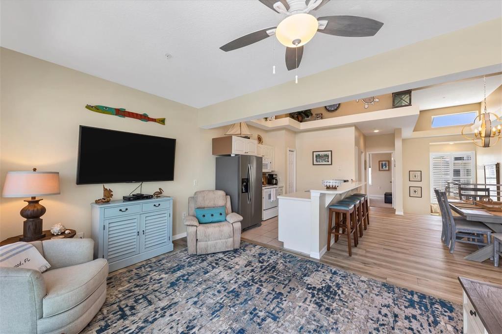 8272 Harborside Circle Englewood, FL 34224 - Photo 25 of 50 a living room with furniture and a flat screen tv