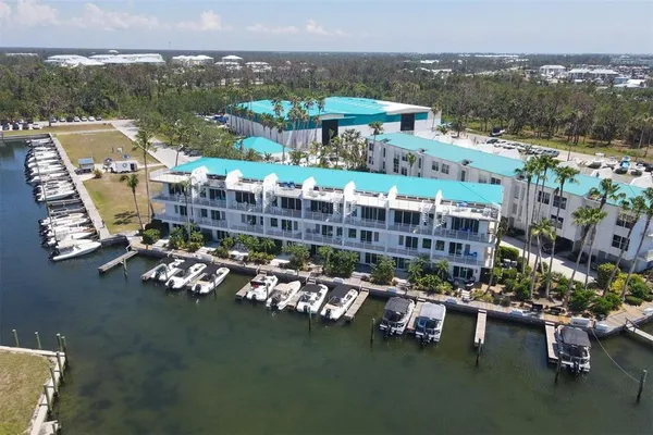 an aerial view of a house with a lake view