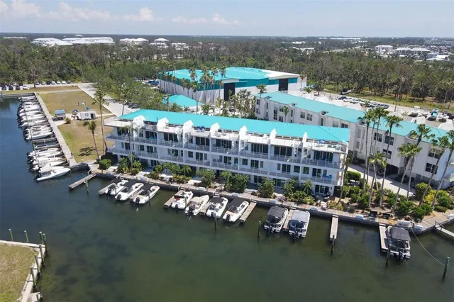 an aerial view of a house with a lake view