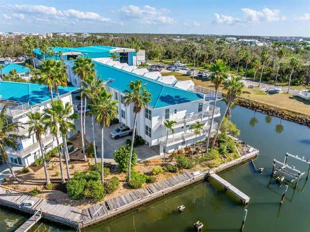 an aerial view of a houses with ocean view