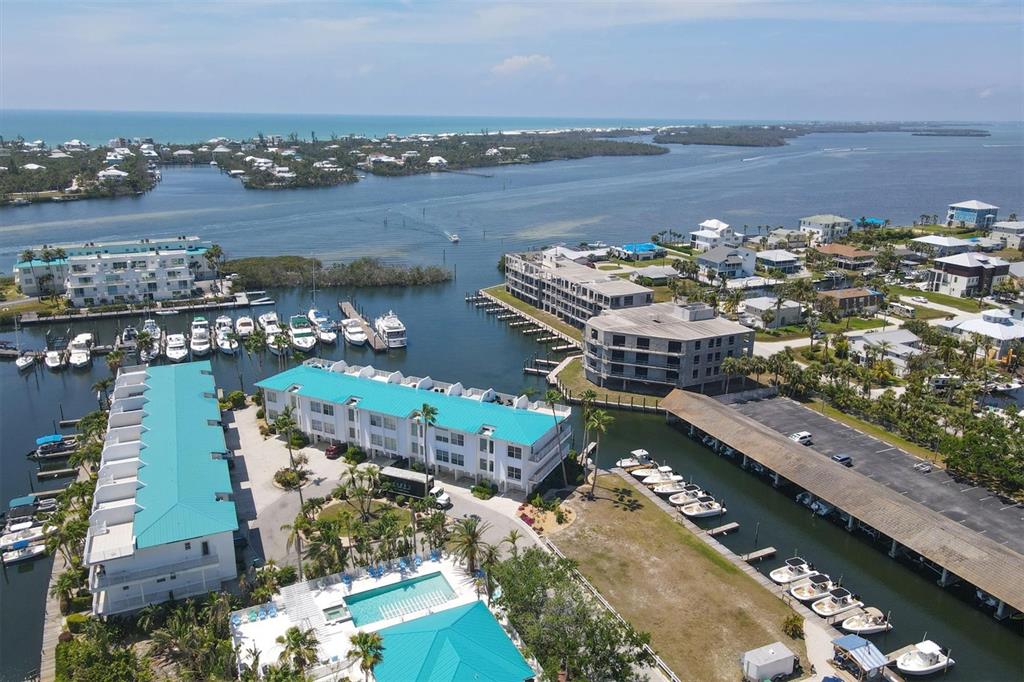 8272 Harborside Circle Englewood, FL 34224 - Photo 3 of 50 an aerial view of a city with ocean view