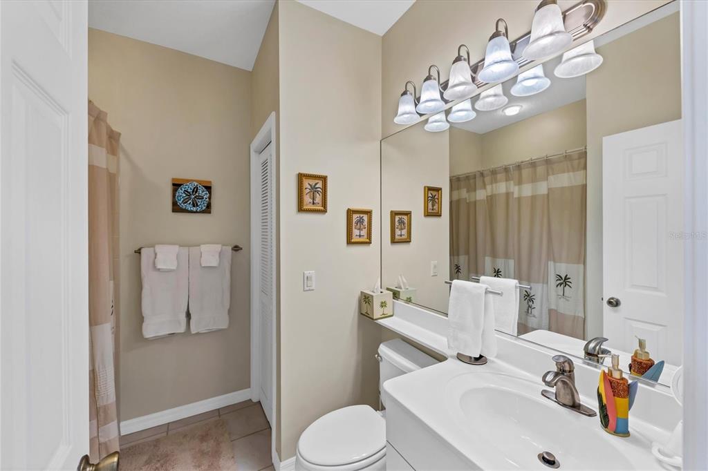 8272 Harborside Circle Englewood, FL 34224 - Photo 32 of 50 a bathroom with a sink and mirror with toilet