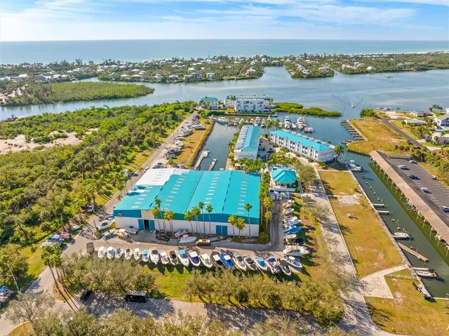 a view of a house with backyard porch and sitting area