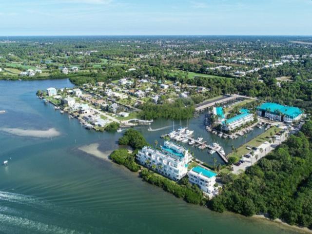8272 Harborside Circle Englewood, FL 34224 - Photo 37 of 45 an aerial view of a city with lots of residential buildings lake and ocean view