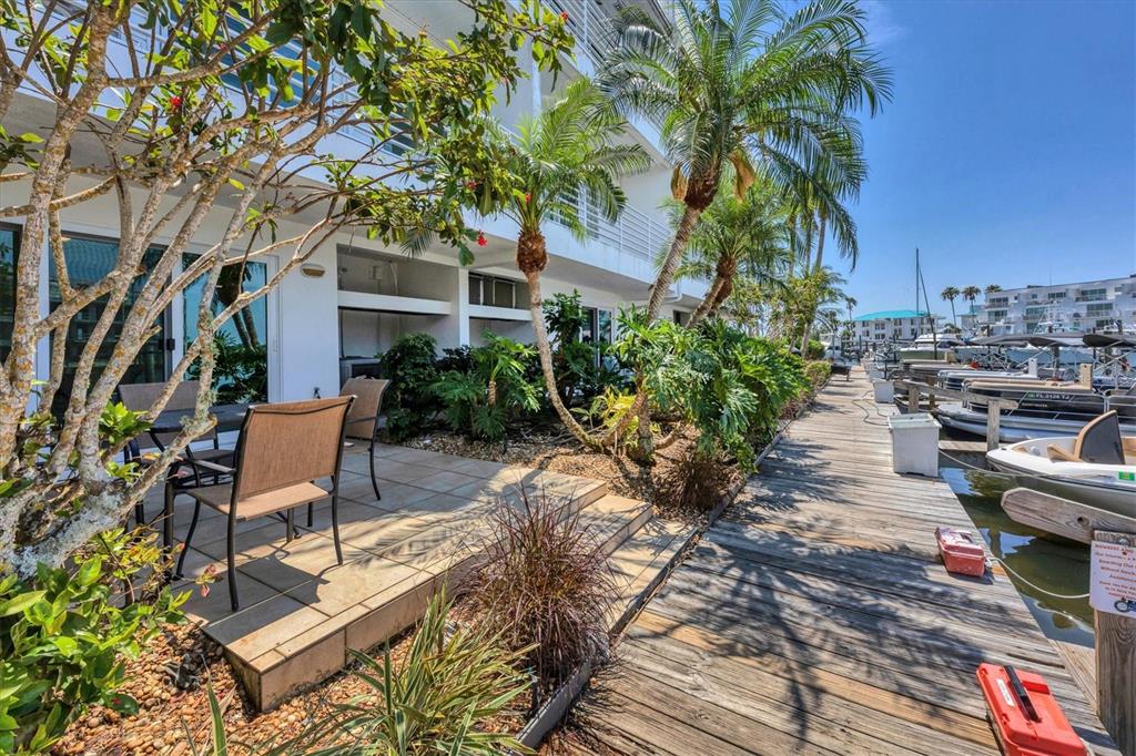 8272 Harborside Circle Englewood, FL 34224 - Photo 41 of 50 a view of a patio with furniture and a garden
