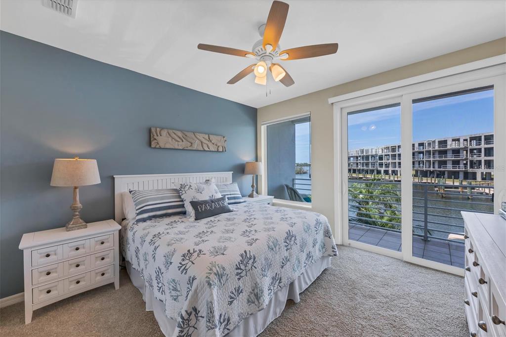 8272 Harborside Circle Englewood, FL 34224 - Photo 8 of 50 a bedroom with a large bed and a window