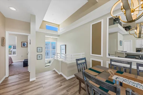 a large kitchen with a table and chairs