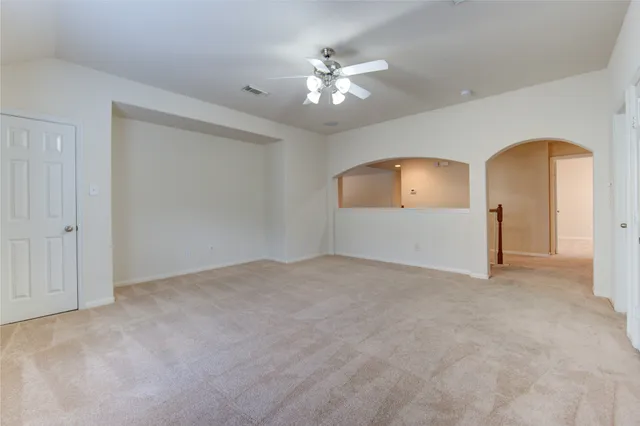 a view of a house with a yard and tree s