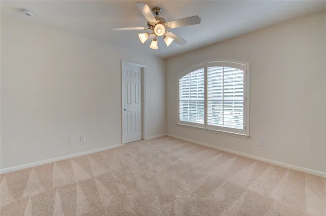 a view of a house with backyard and a patio