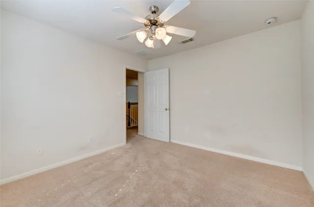 a view of a lake with houses in the back
