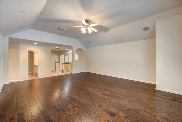 a view of a lake with houses in the back