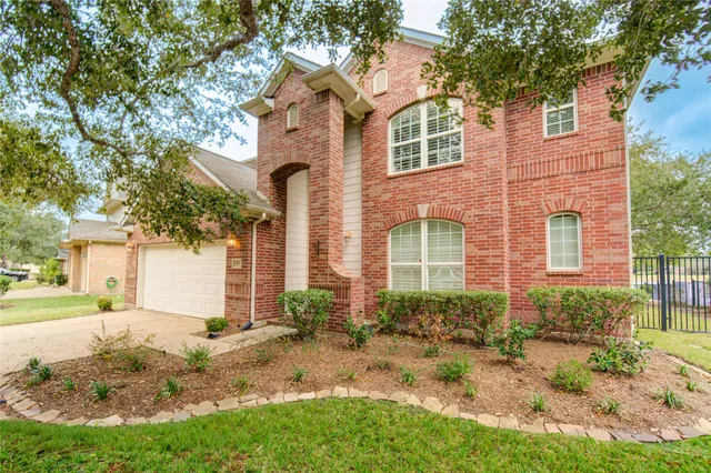 an empty room with closet and windows