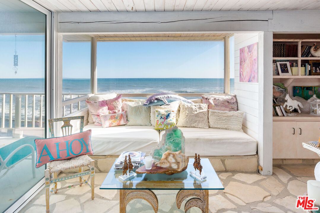 24102 Malibu Road Malibu, CA 90265 - Photo 5 of 14 a living room with furniture and a rug