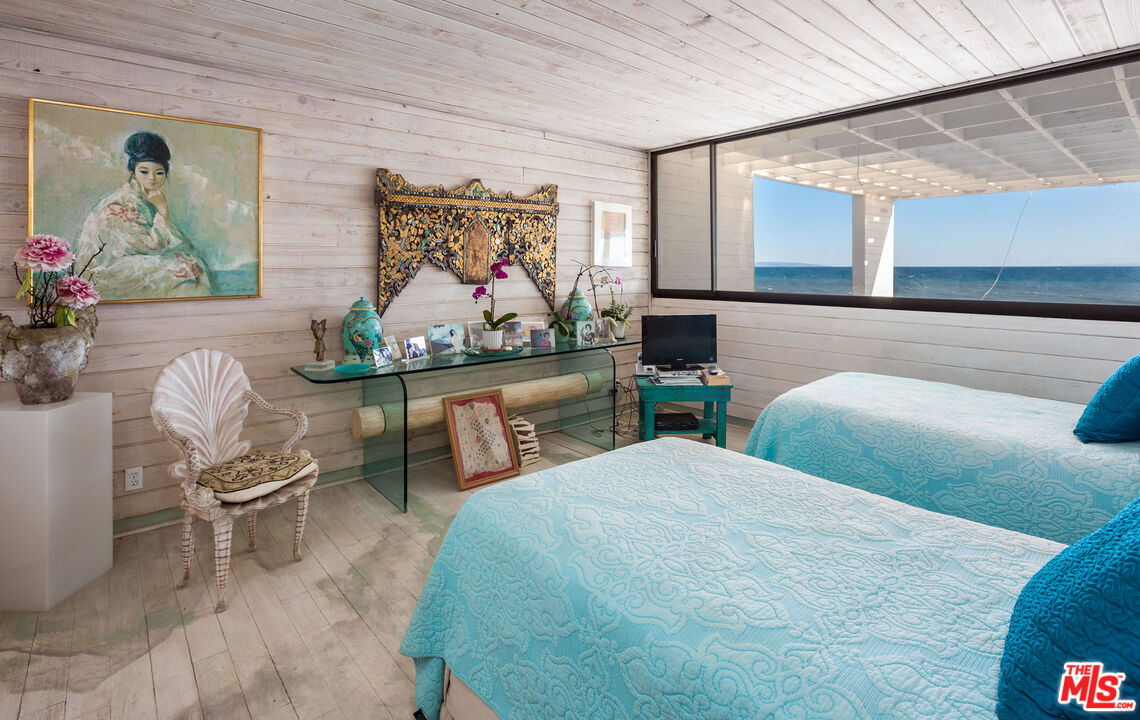 24102 Malibu Road Malibu, CA 90265 - Photo 10 of 14 a bedroom with furniture and painting on the wall