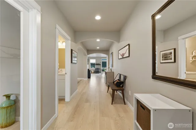 a view of a hallway with seating area